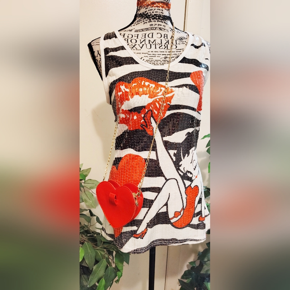 Stylish Graphic Women's Top with Red Accents. Is Missing A Few Accents